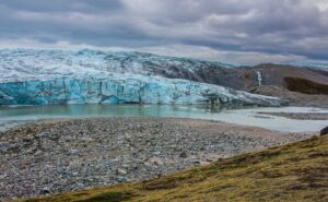 ACT_D1-3 Blue Greenlandic ice-cap glacier drifting and turning into the river.