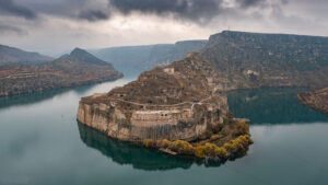 A-Turkey-46-1 a castle carved in the rock wall with a Tigris river around it