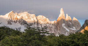 El Chalten circuit (10 of 14) Sharp spike like monolith rising over the high ridge and rorrests lighted by the sunrise