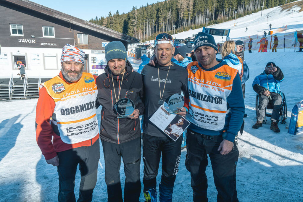 Two racers with organization team of the sleddog race