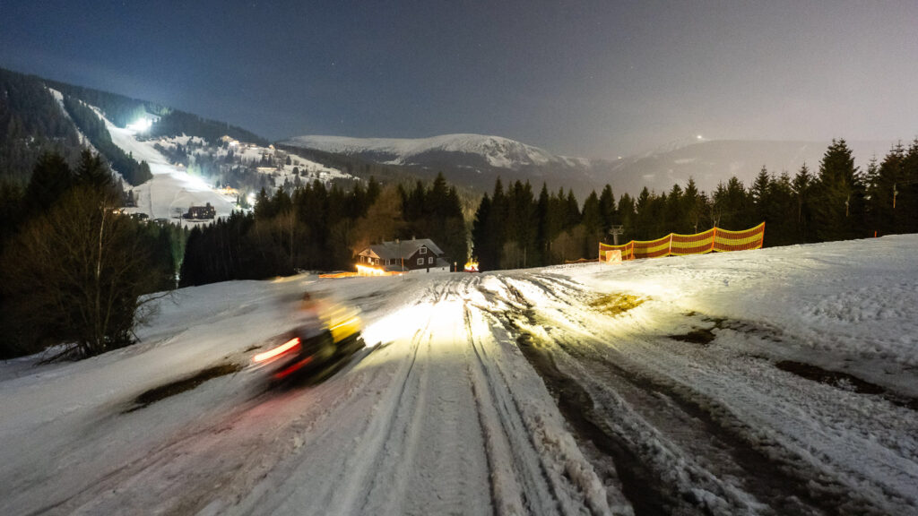 Scooter riding in the giant snowy mountains
