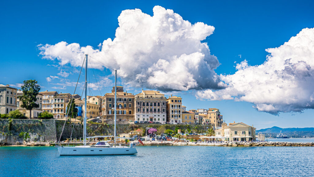 A sailboat infornt of the Korfu town in greek Korfu
