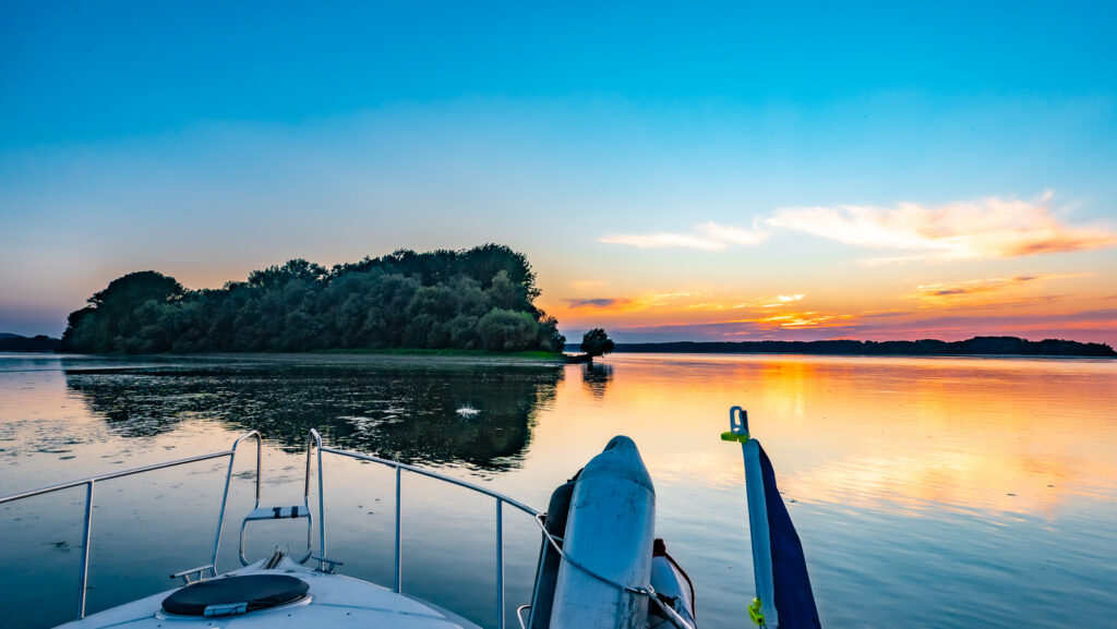 Sunset over donau from the boat at anchoring spot