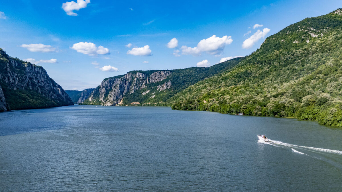 Speed boat gliding thru Iron gates in Romania