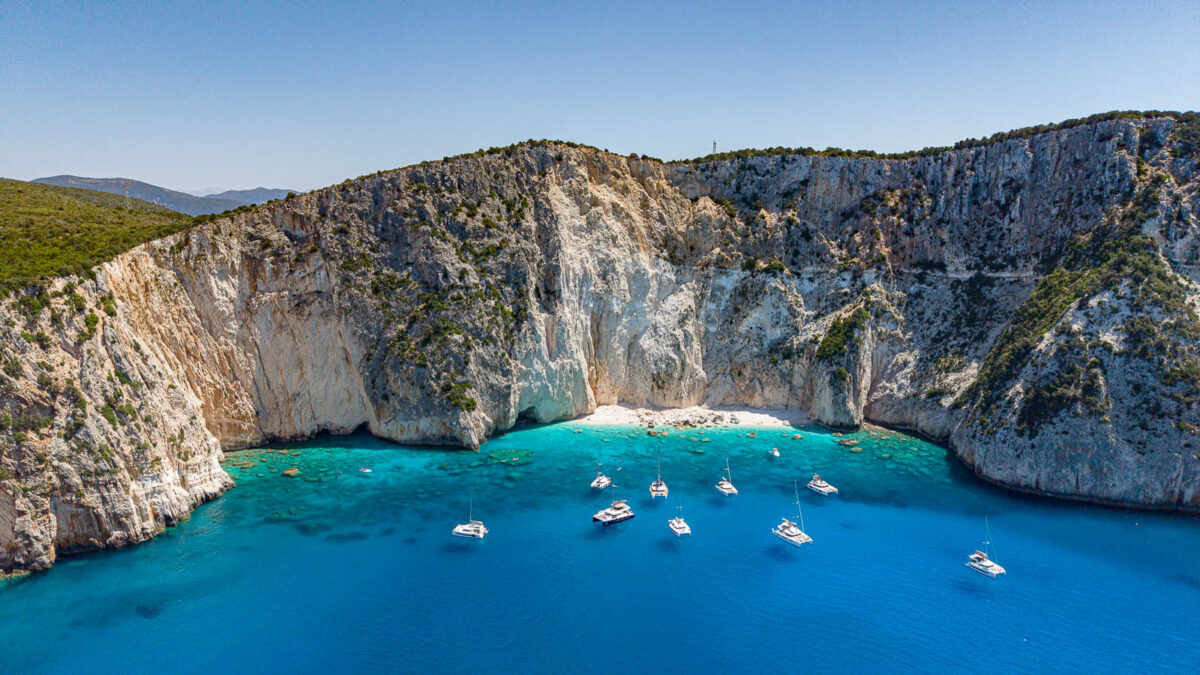Few boats anchored in picturesque bay of Lefkada island